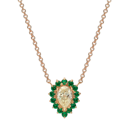 Drop diamond with round emeralds